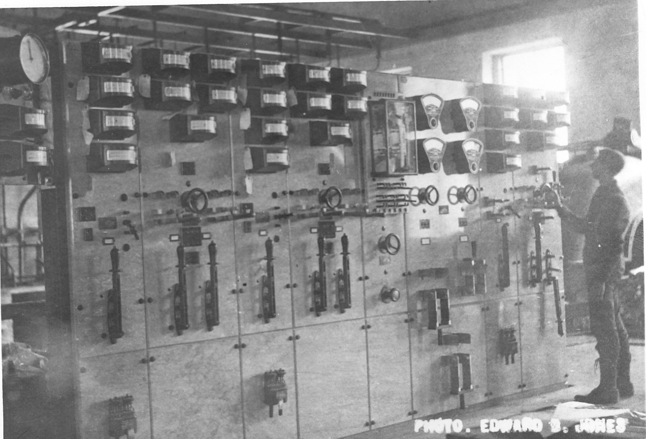 Black and white photo of controls and gauges for old power house