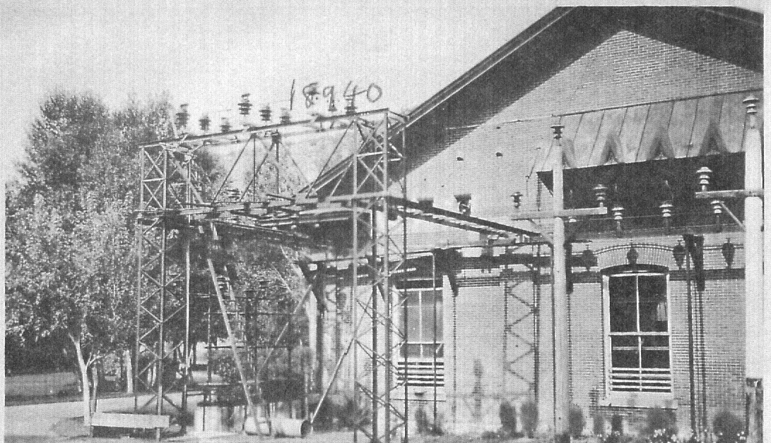 Black and white photo of electrical lines outside the old power house